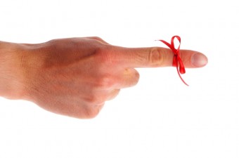 finger with red bow